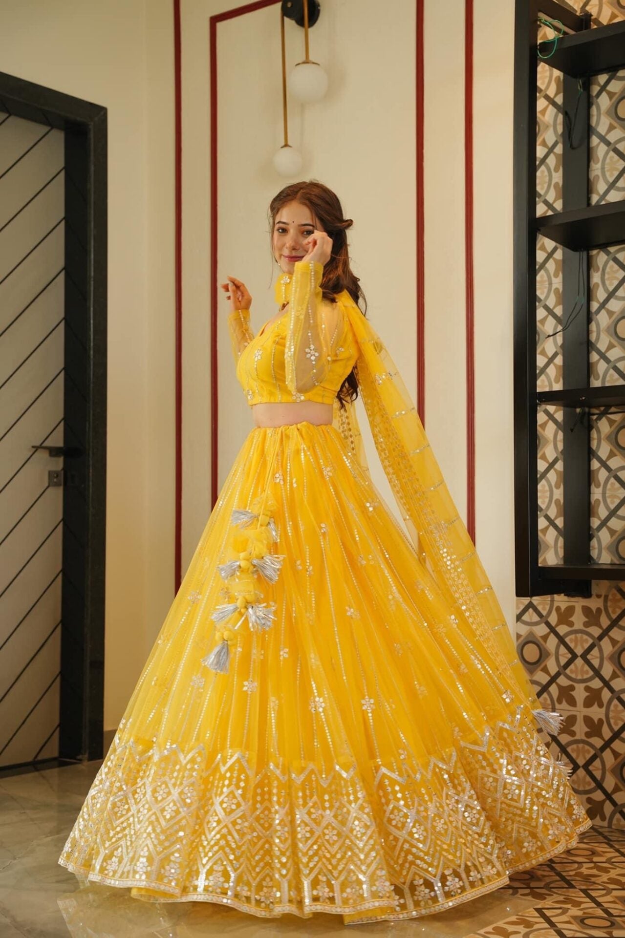 Aisha yellow net lehenga choli set